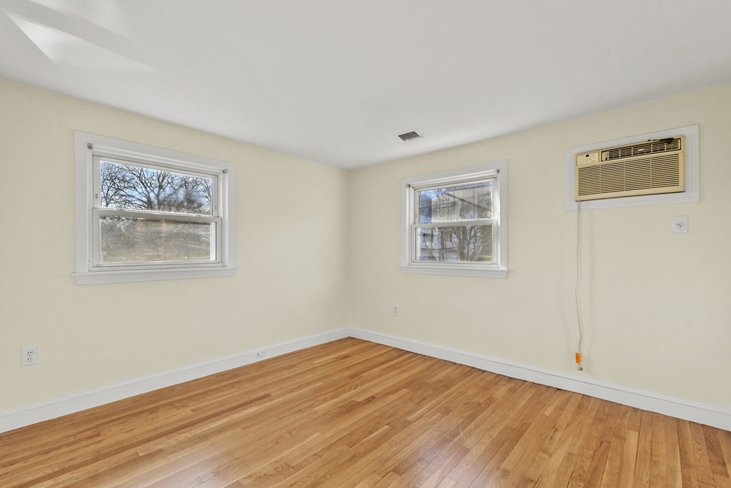 72 Cambridge Road, Unit 2 Woburn, MA 01801 - Photo 21 of 30 a view of empty room with wooden floor and fan