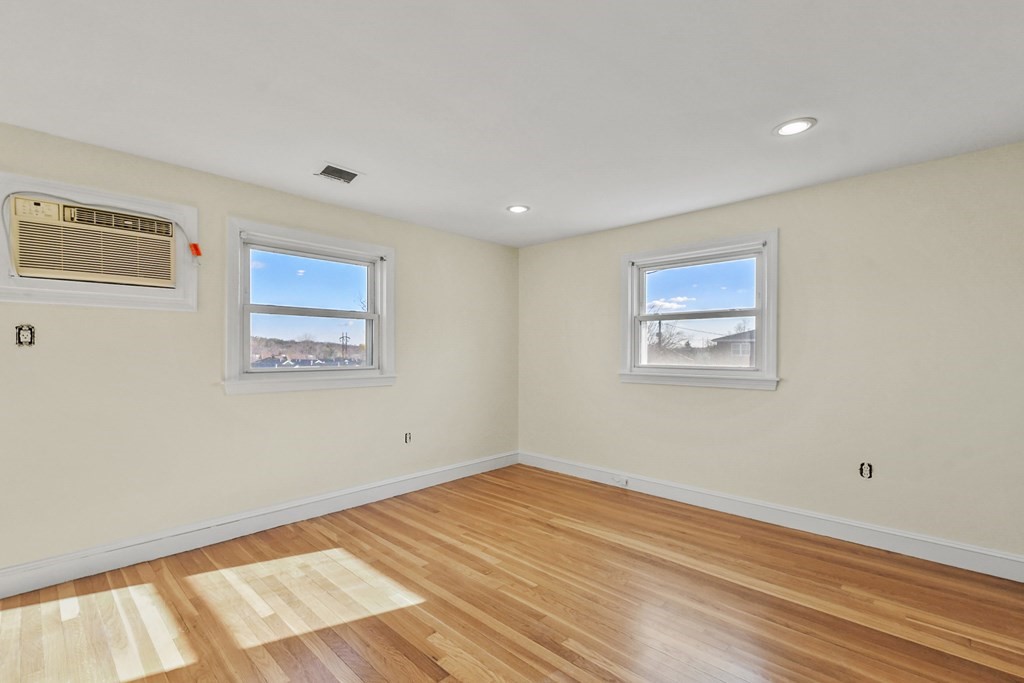 72 Cambridge Road, Unit 2 Woburn, MA 01801 - Photo 23 of 30 a view of empty room with wooden floor