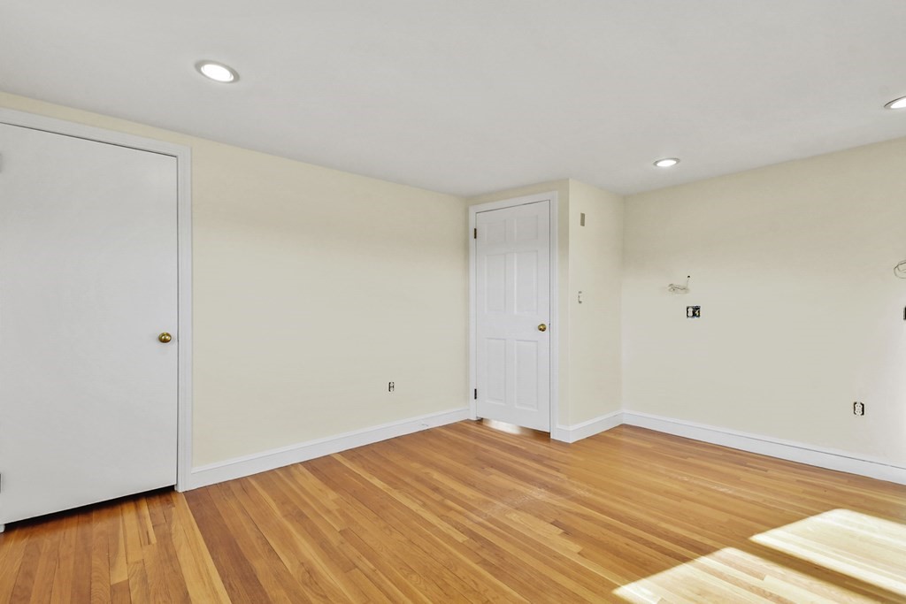 72 Cambridge Road, Unit 2 Woburn, MA 01801 - Photo 25 of 30 a view of a room with wooden floor