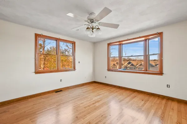 an empty room with window and windows