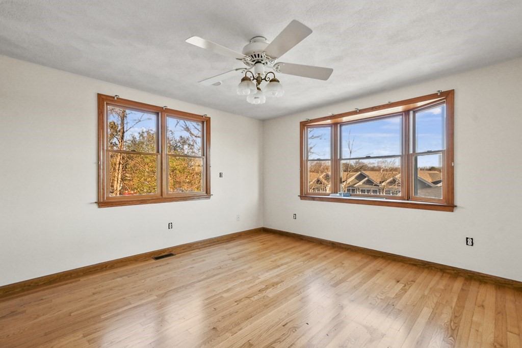 72 Cambridge Road, Unit 2 Woburn, MA 01801 - Photo 6 of 30 an empty room with window and windows