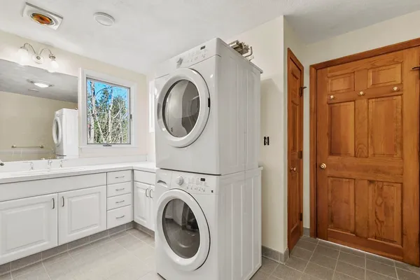a spacious bathroom with a sink and a mirror