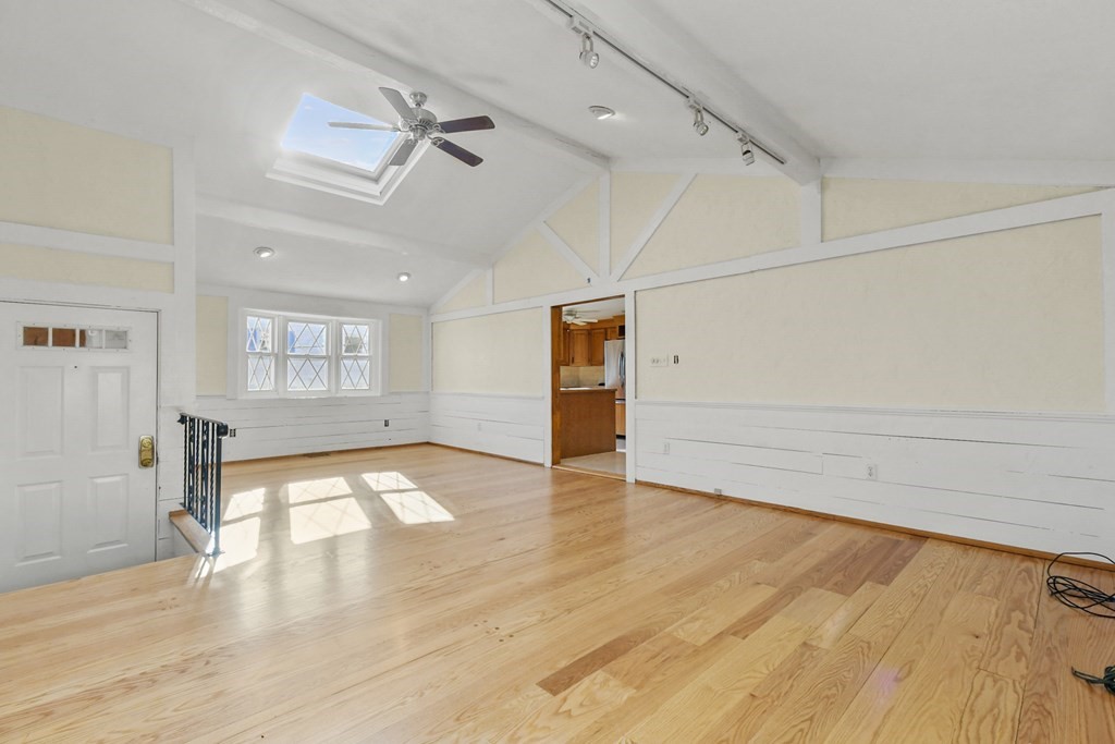 72 Cambridge Road, Unit 2 Woburn, MA 01801 - Photo 9 of 30 a view of empty room with wooden floor and fan
