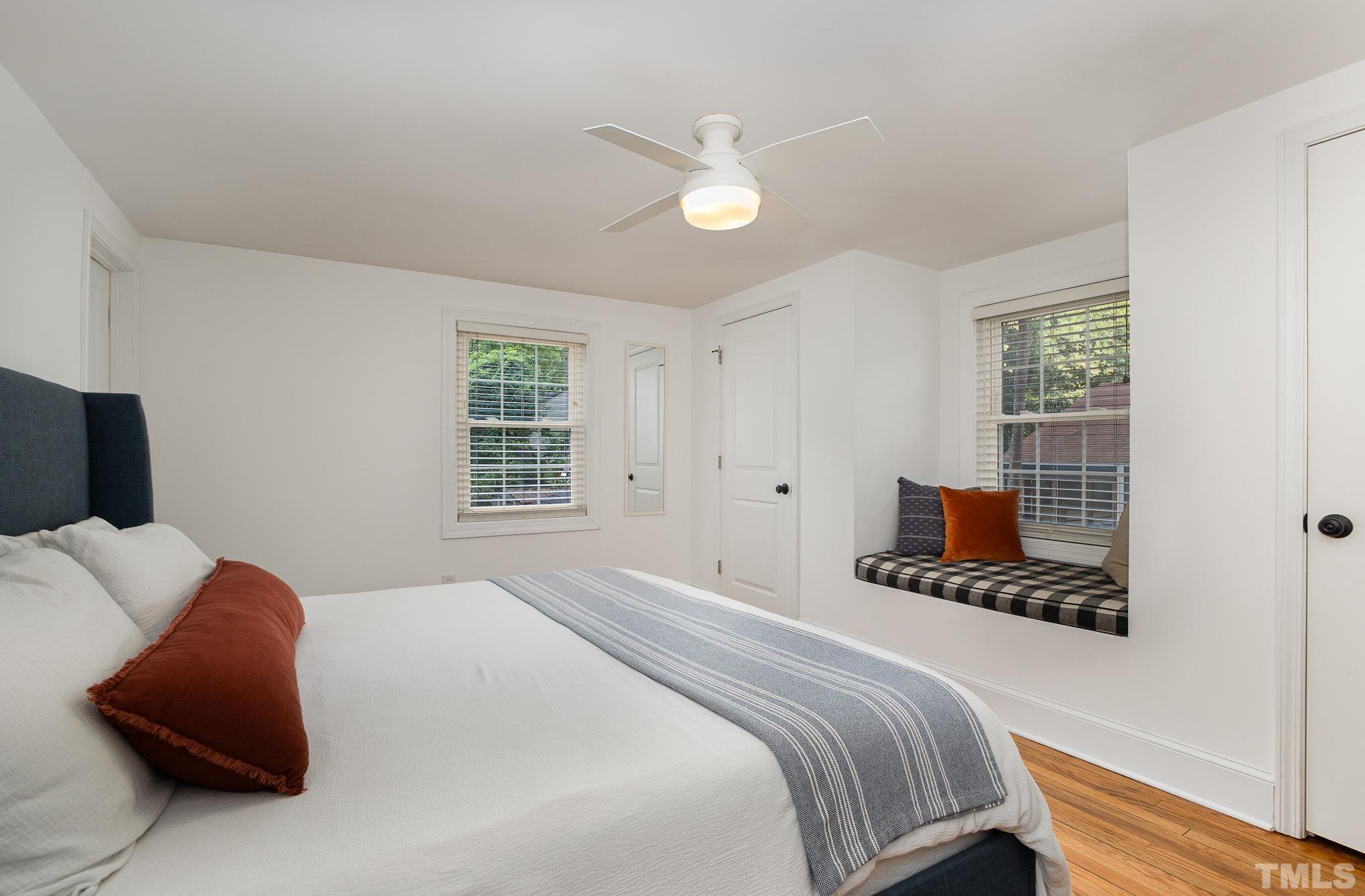 710 Tyler Road Raleigh, NC 27604 - Photo 13 of 27 a bedroom with a bed and a couch