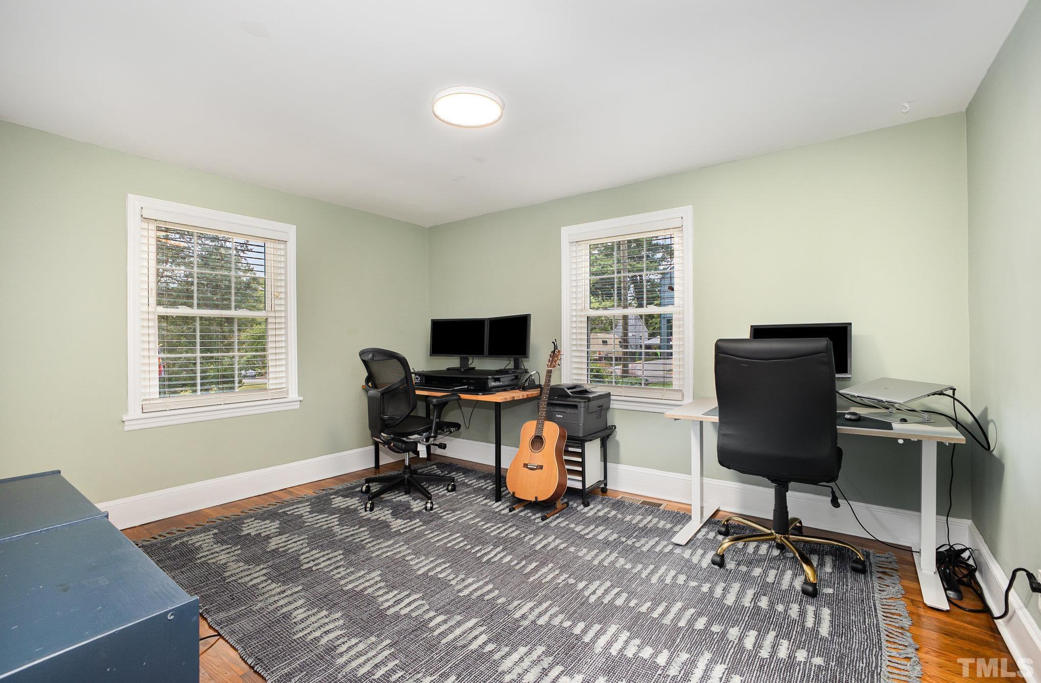 710 Tyler Road Raleigh, NC 27604 - Photo 16 of 27 a view of a workspace with furniture and a window