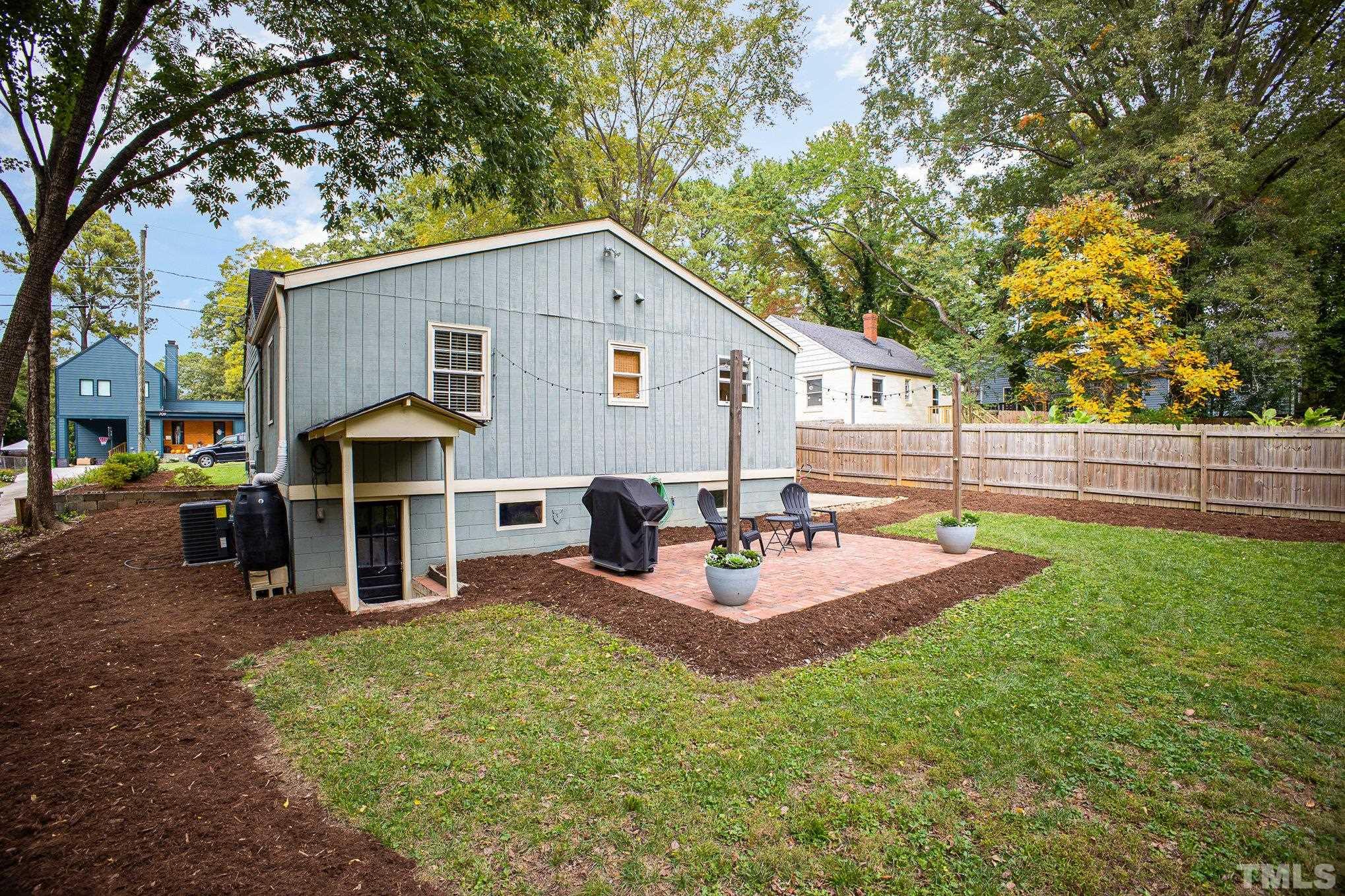 710 Tyler Road Raleigh, NC 27604 - Photo 24 of 27 a view of a house with backyard and sitting area