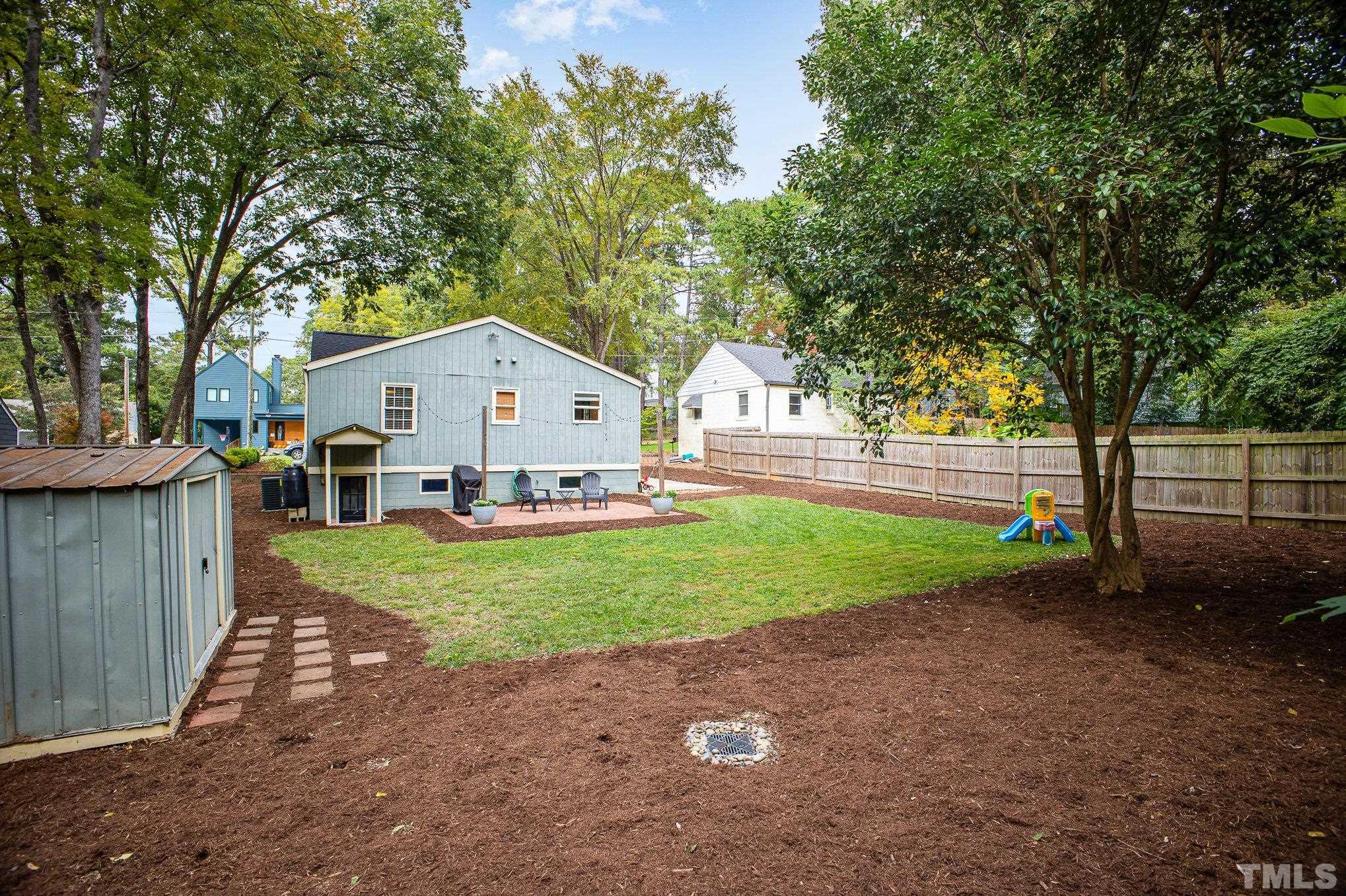 710 Tyler Road Raleigh, NC 27604 - Photo 26 of 27 a view of backyard of house and green space