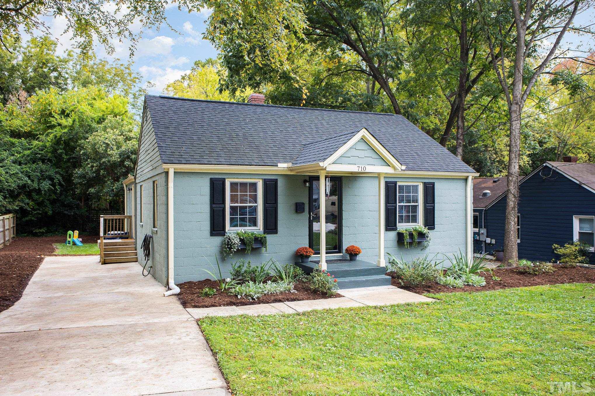 710 Tyler Road Raleigh, NC 27604 - Photo 3 of 27 a front view of a house with garden