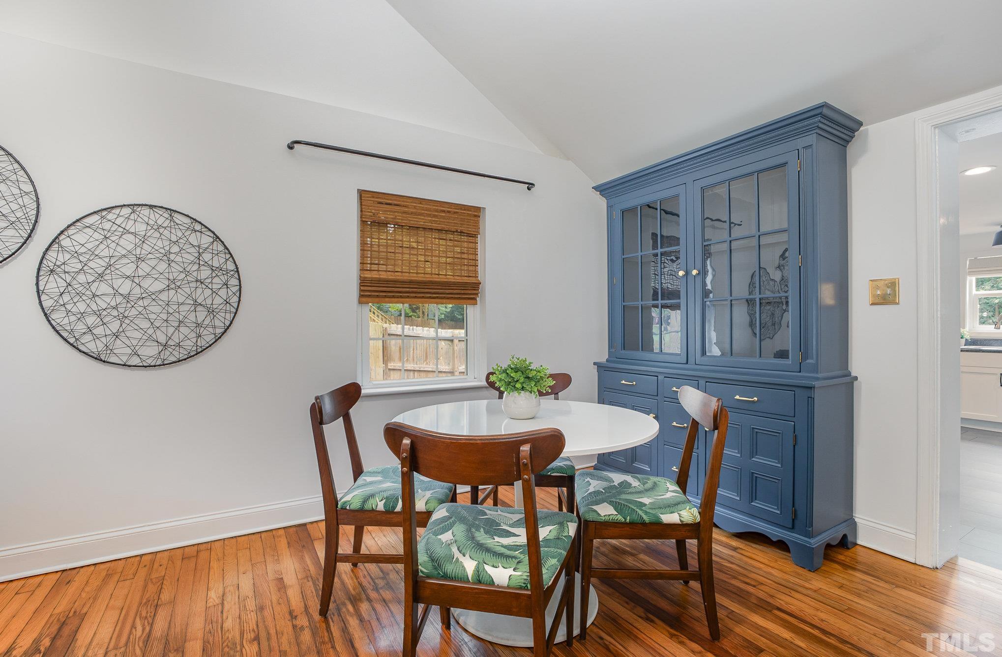710 Tyler Road Raleigh, NC 27604 - Photo 9 of 27 a view of a dining room with furniture and wooden floor