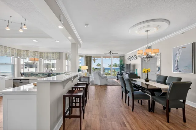 a view of a balcony dining table and chairs