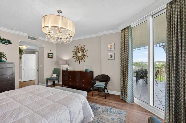 a bedroom with a bed and a table with chair