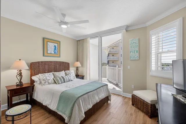 a bathroom with a granite countertop sink a toilet a mirror and a shower