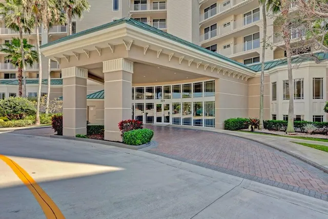 an aerial view of a house a yard and parking