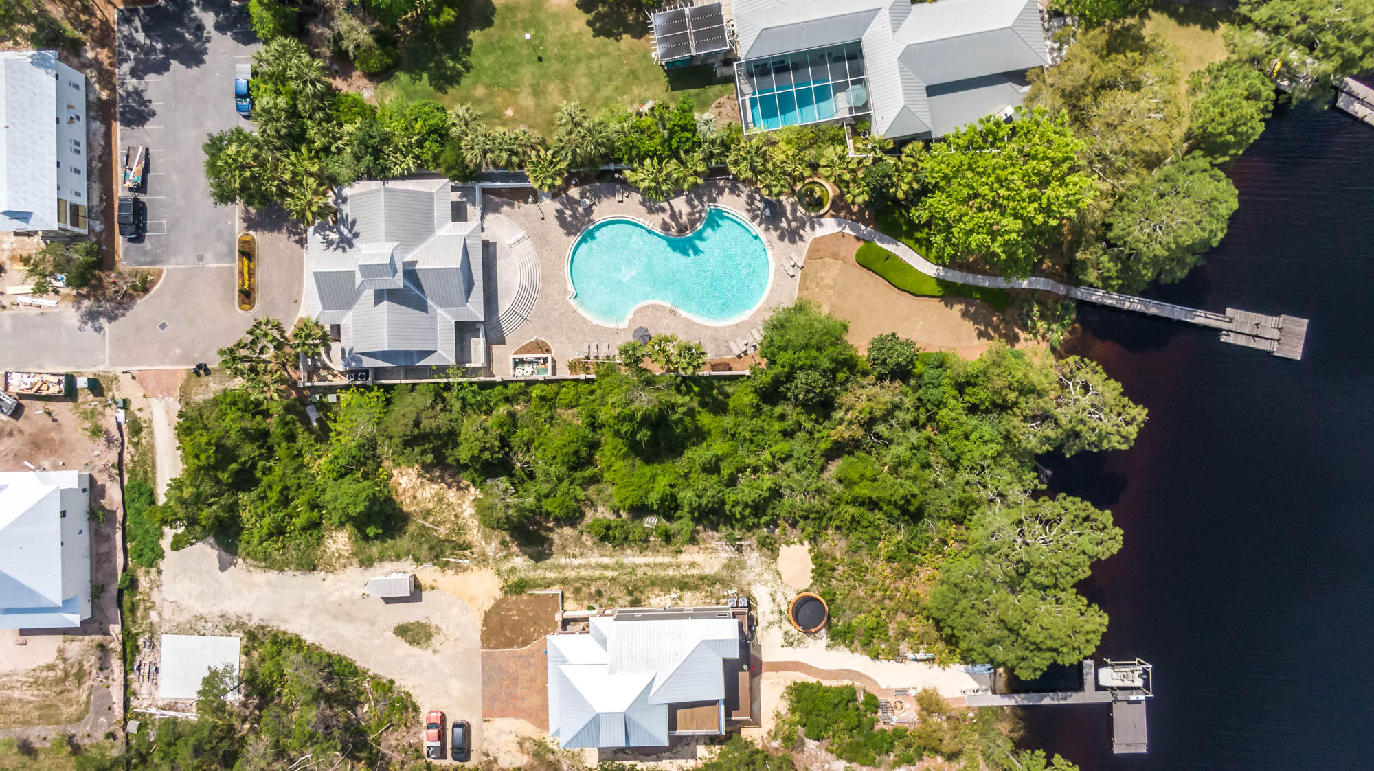Tbd Tbd Grand Pointe Dr Inlet Beach Inlet Beach, FL 32461 - Photo 14 of 20 an aerial view of a house with a yard and lake view