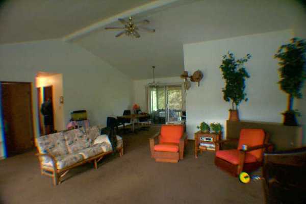 4885 Menehune Road Waimea, HI 96796 - Photo 3 of 3 a bedroom with furniture and a potted plant