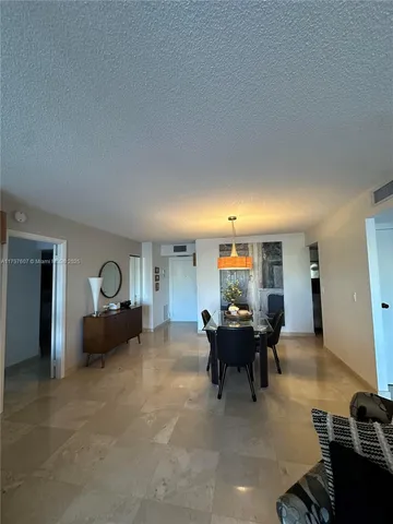 a living room with furniture window and couch