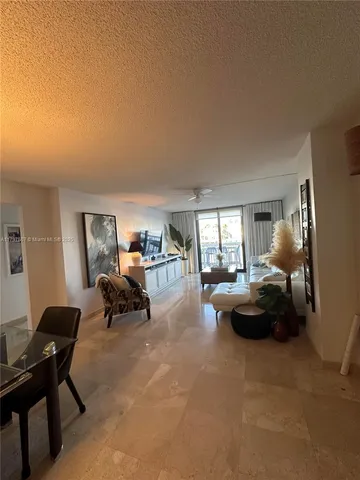 a spacious bedroom with a large bed and a dresser