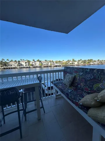 a view of a chairs and table in patio