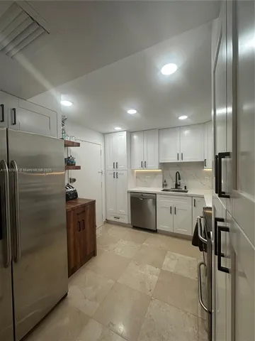 a view of a livingroom with furniture window and wooden floor