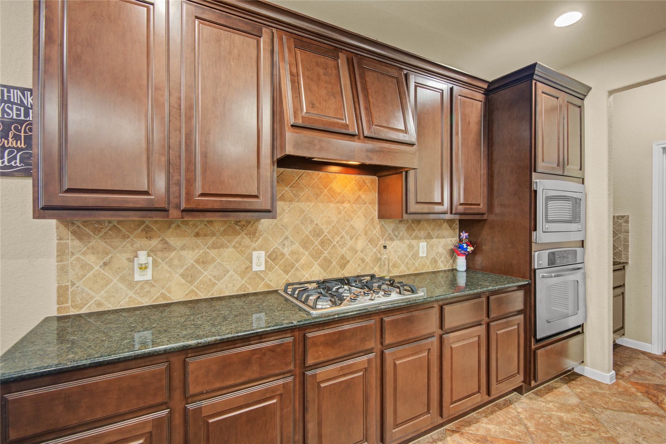 6007 Valhalla Drive Spring, TX 77379 - Photo 12 of 37 The chef-inspired kitchen features stainless steel appliances, gas cooking, granite counters, and abundant storage.