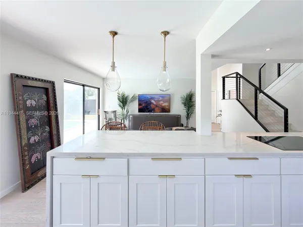 a view of living room kitchen with furniture and window