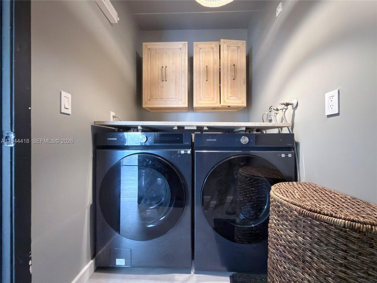 760 Windtree Way Wellington, FL 33414 - Photo 18 of 45 a utility room with a sink washer and dryer