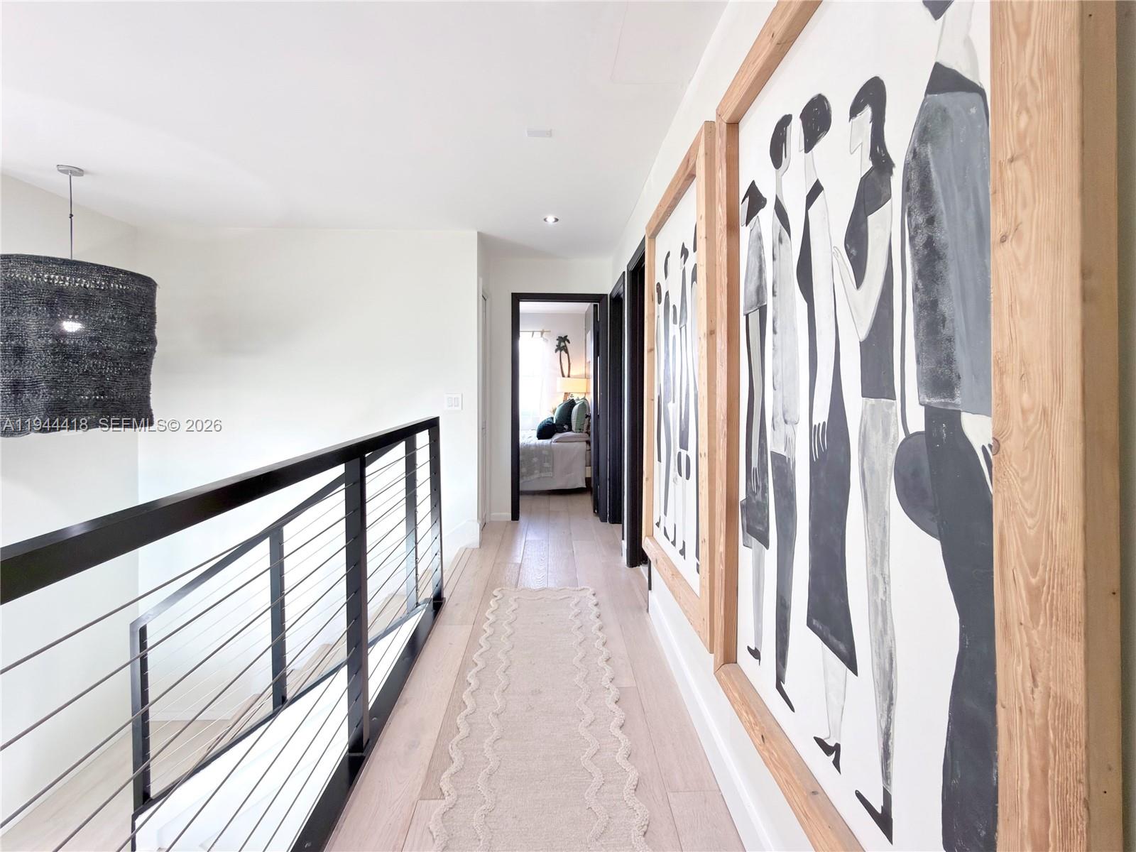 760 Windtree Way Wellington, FL 33414 - Photo 20 of 45 a view of a hallway with wooden floor and staircase