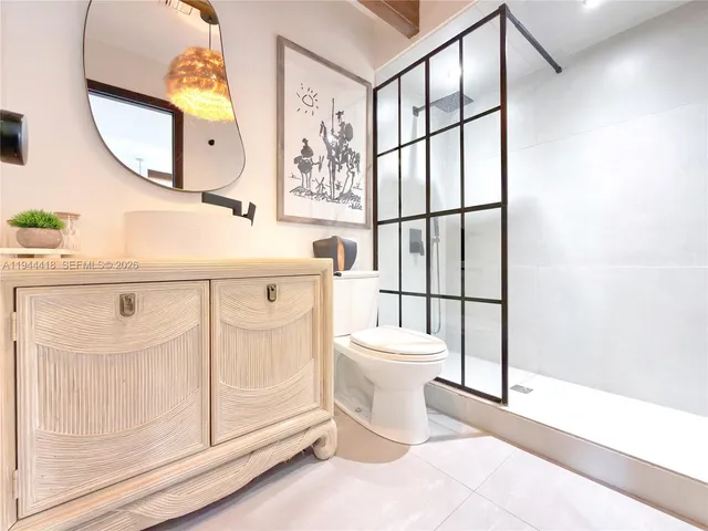 a bedroom with bed and window