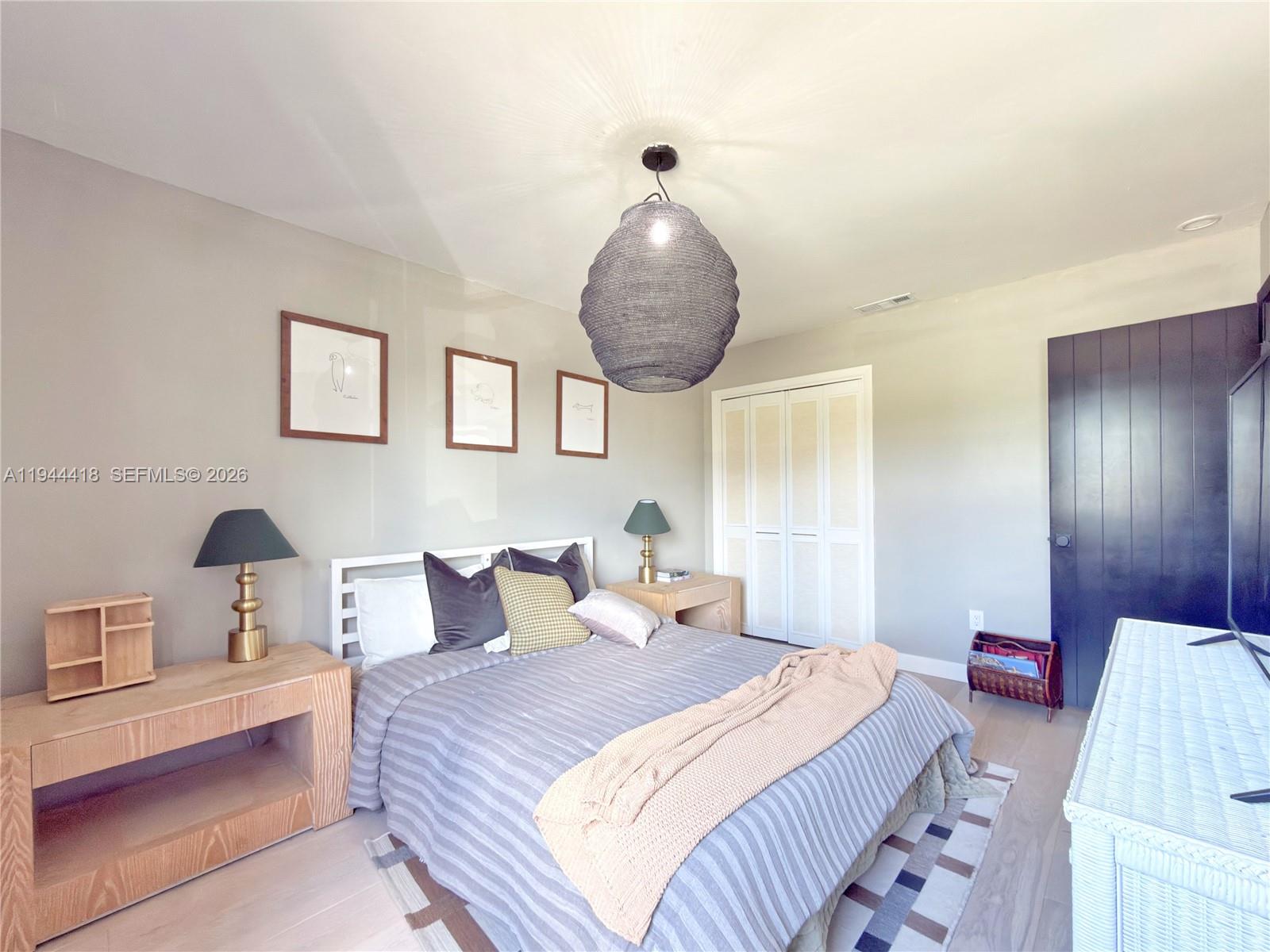 760 Windtree Way Wellington, FL 33414 - Photo 28 of 45 a bedroom with bed and window