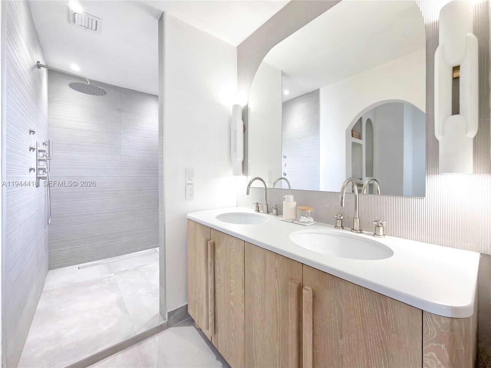 760 Windtree Way Wellington, FL 33414 - Photo 29 of 45 a bathroom with a double vanity sink mirror and shower