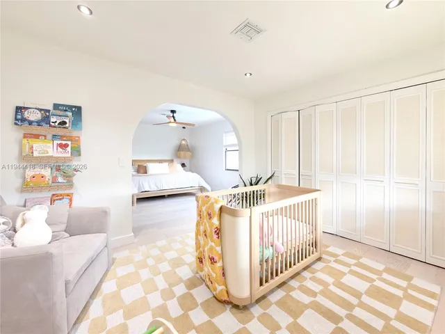 a bedroom with bed and window