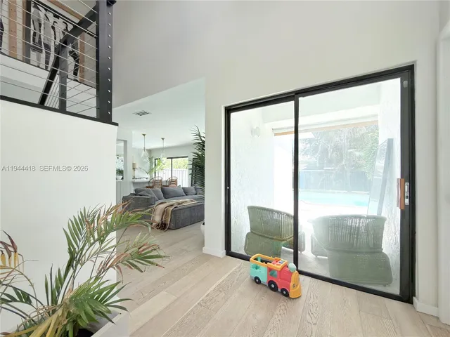 a room with furniture and a large window