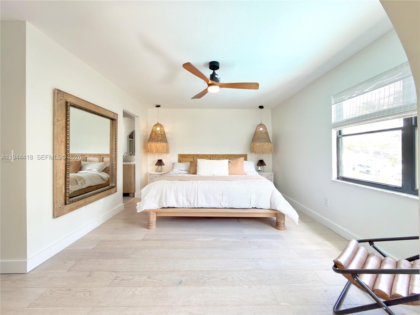 760 Windtree Way Wellington, FL 33414 - Photo 34 of 45 a bedroom with a bed and window