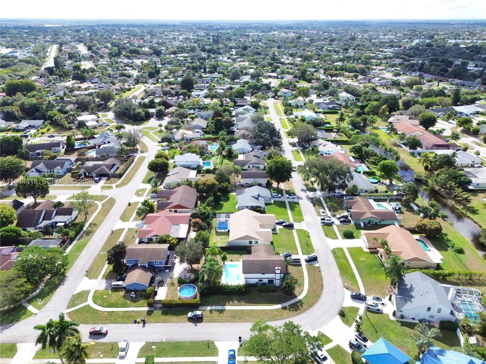 760 Windtree Way Wellington, FL 33414 - Photo 40 of 45 an aerial view of residential houses with outdoor space