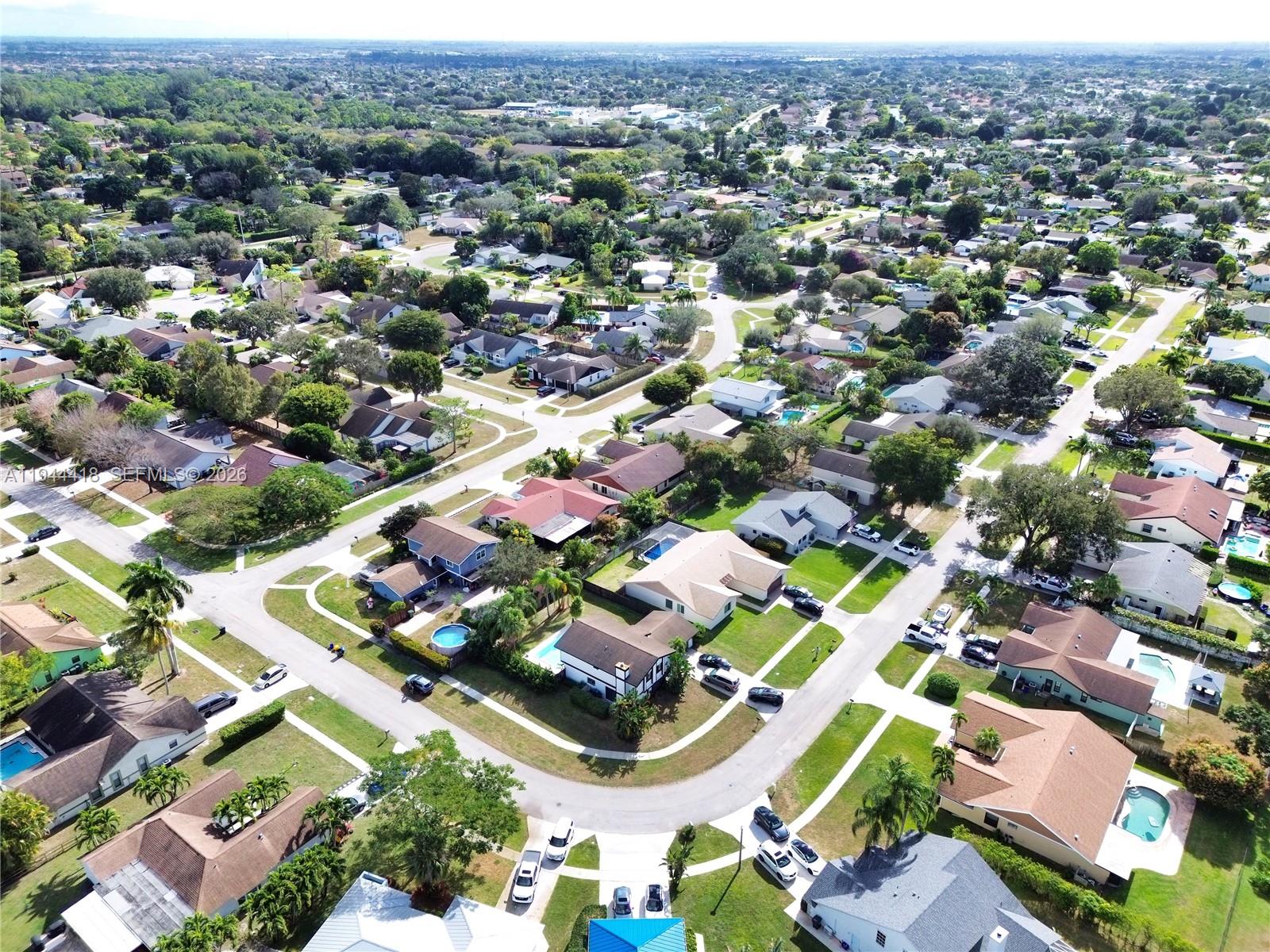 760 Windtree Way Wellington, FL 33414 - Photo 41 of 45 an aerial view of residential houses with outdoor space and parking