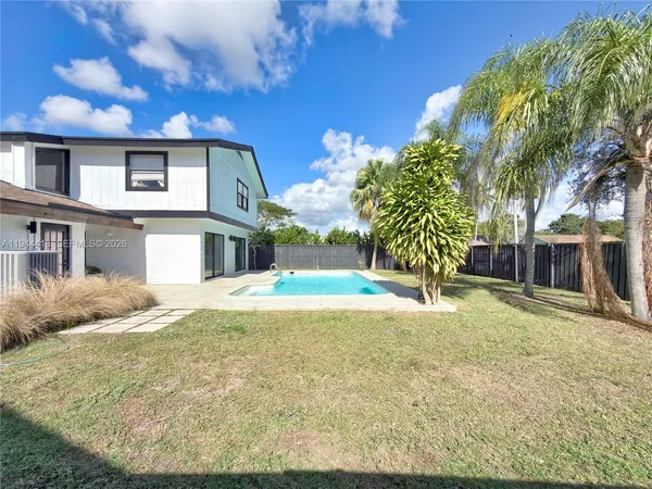 a swimming pool with an outdoor space