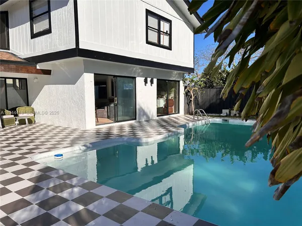 a view of a front of a house with a yard