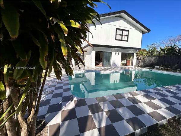 a black and white checkered floor with a black white checkered floor