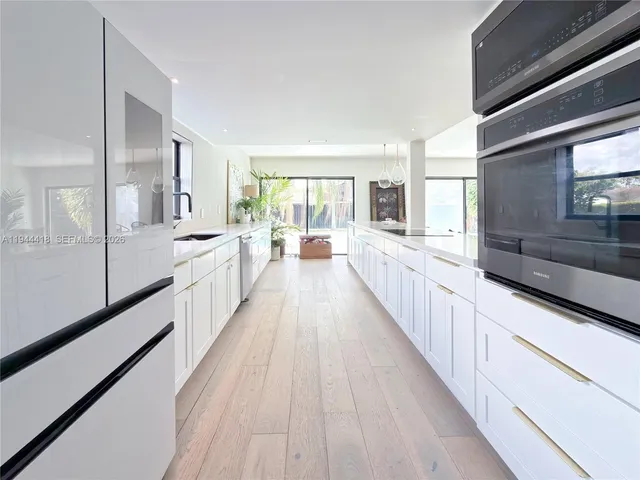 a view of a living room filled with furniture