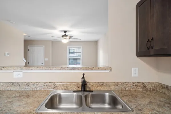 a kitchen with a sink and dishwasher