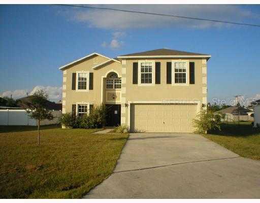 301 Bangor Way Kissimmee, FL 34758 - Photo 1 of 1 a view of a house with a yard