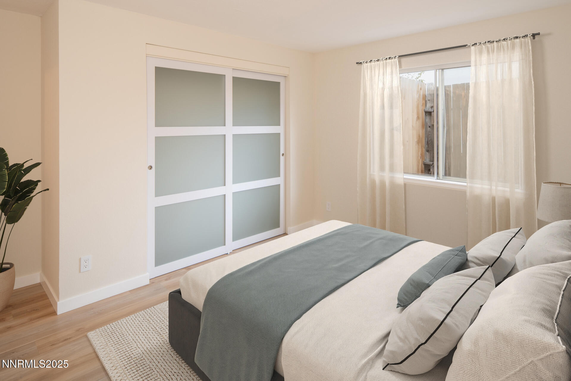 1605 Alamo Street Reno, NV 89503 - Photo 13 of 44 a bedroom with a bed and a window