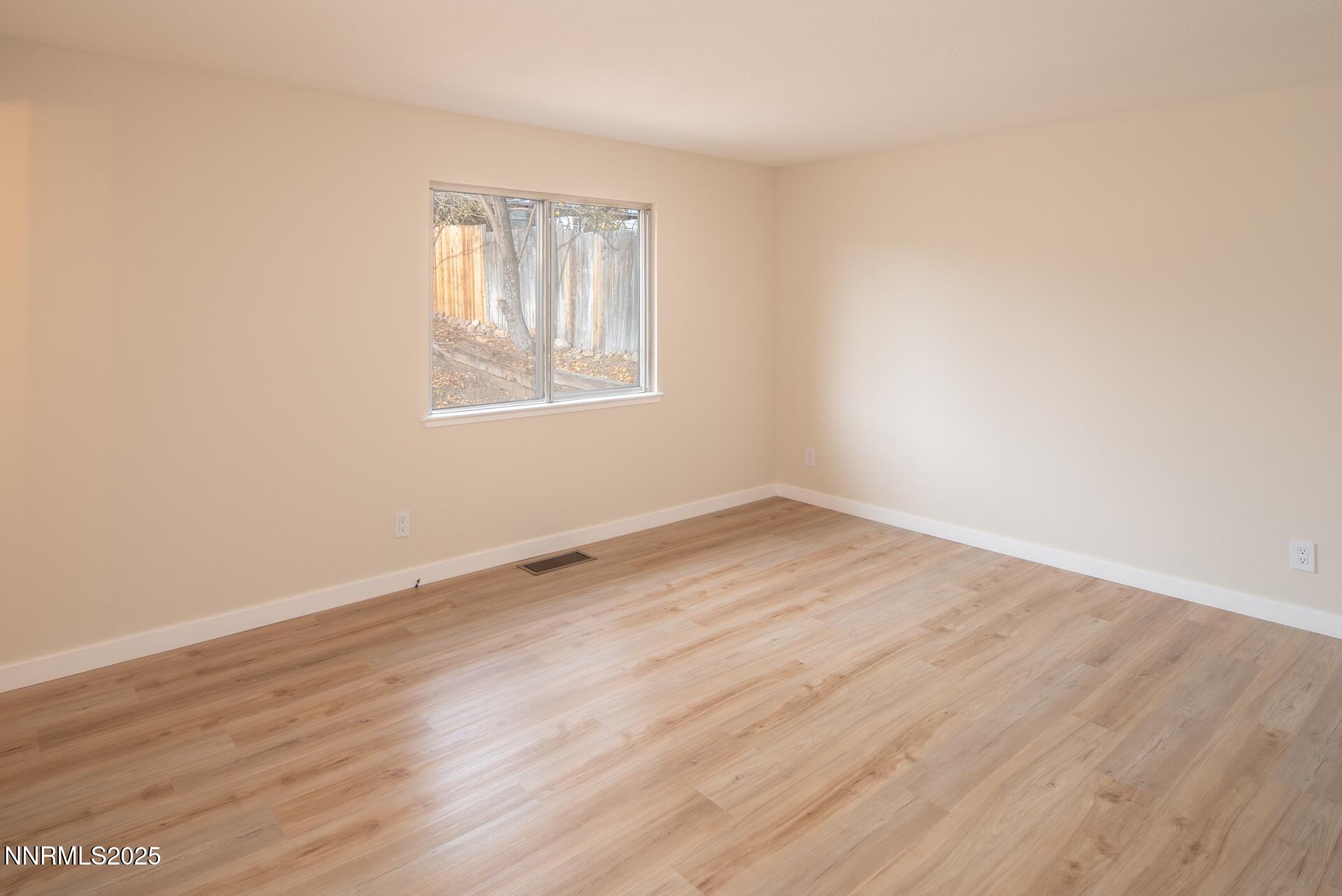 1605 Alamo Street Reno, NV 89503 - Photo 24 of 44 an empty room with wooden floor and windows