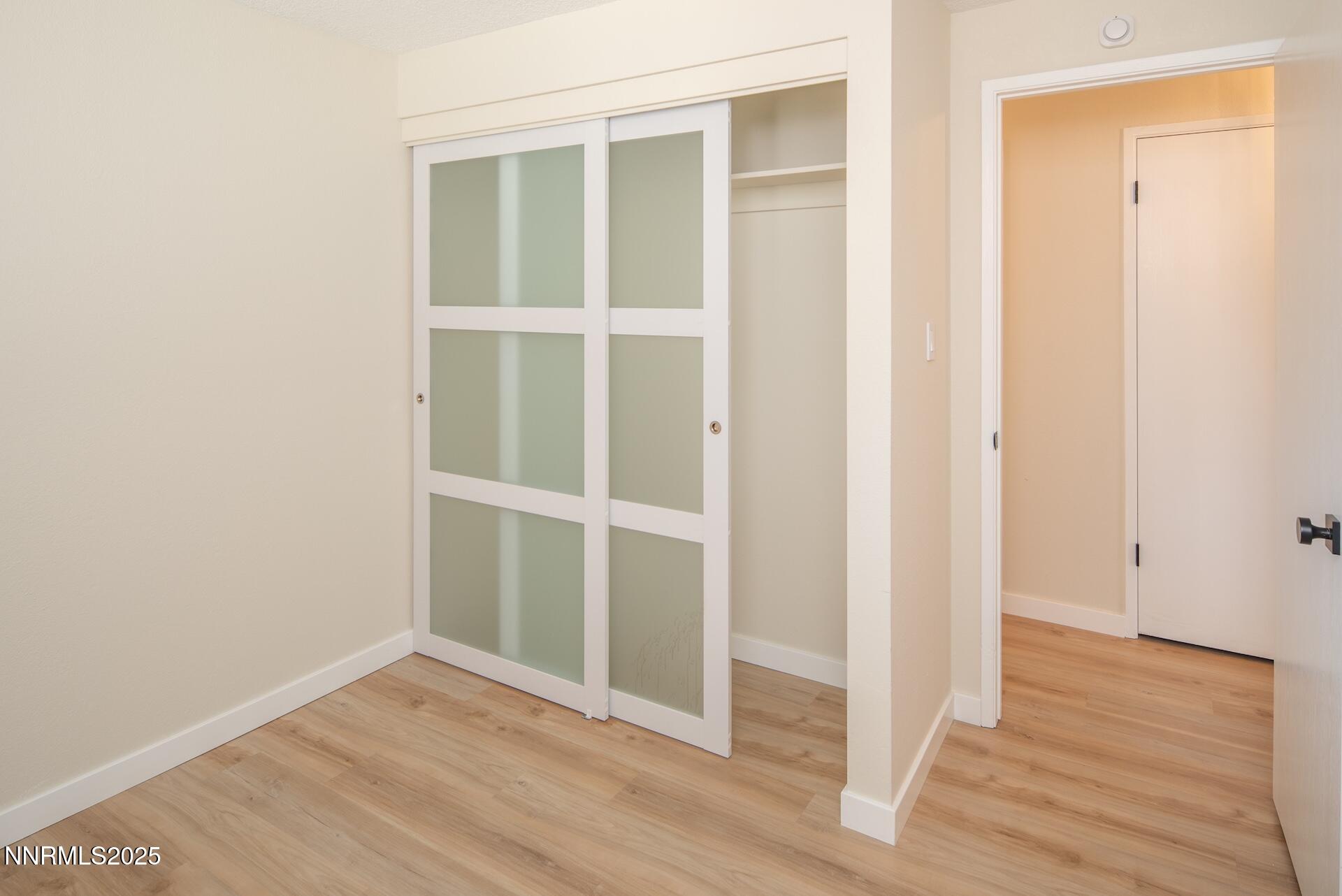 1605 Alamo Street Reno, NV 89503 - Photo 25 of 44 a view of an empty room with wooden floor