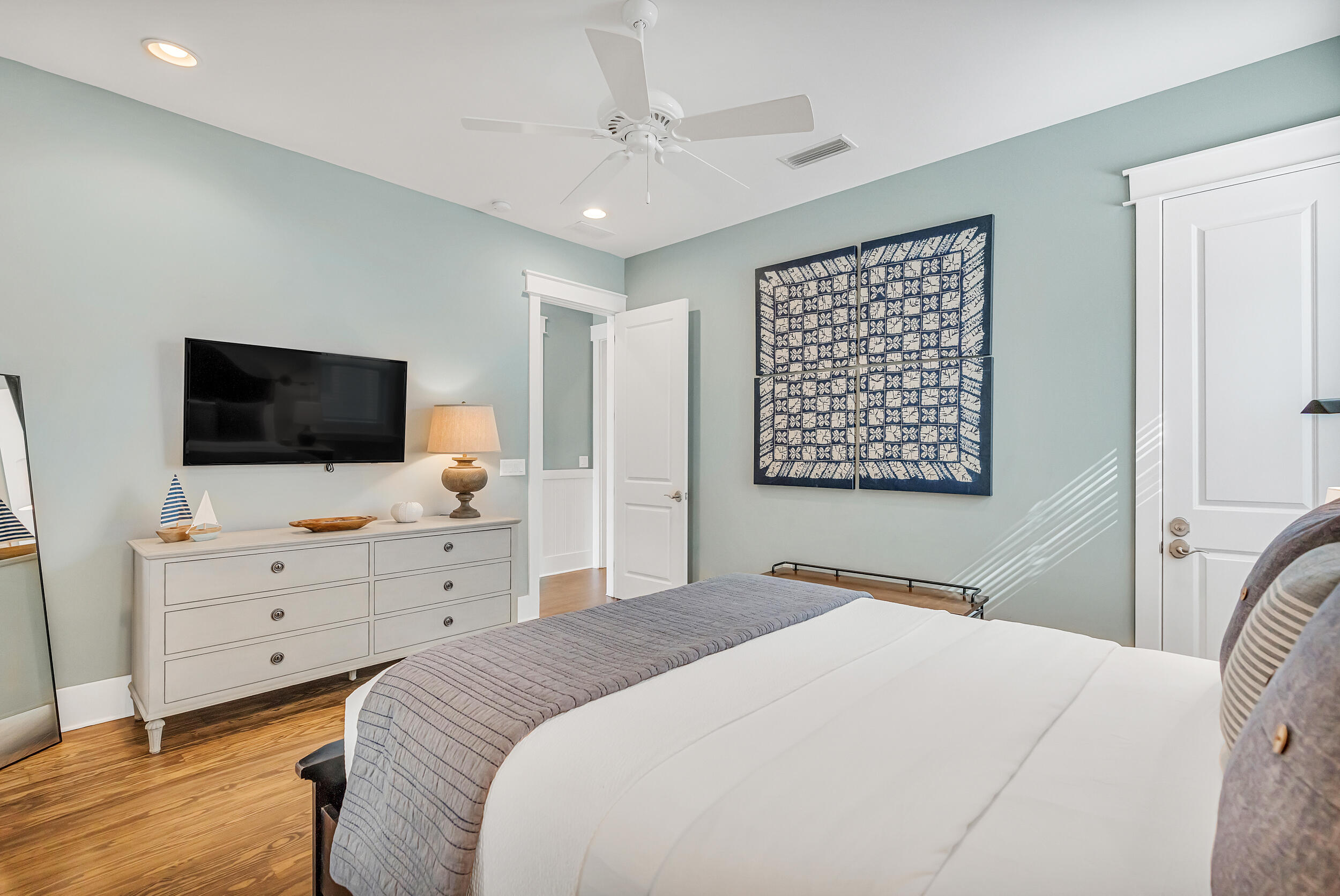 654 Flatwoods Forest Loop Santa Rosa Beach, FL 32459 - Photo 19 of 53 a bedroom with a bed and a flat screen tv