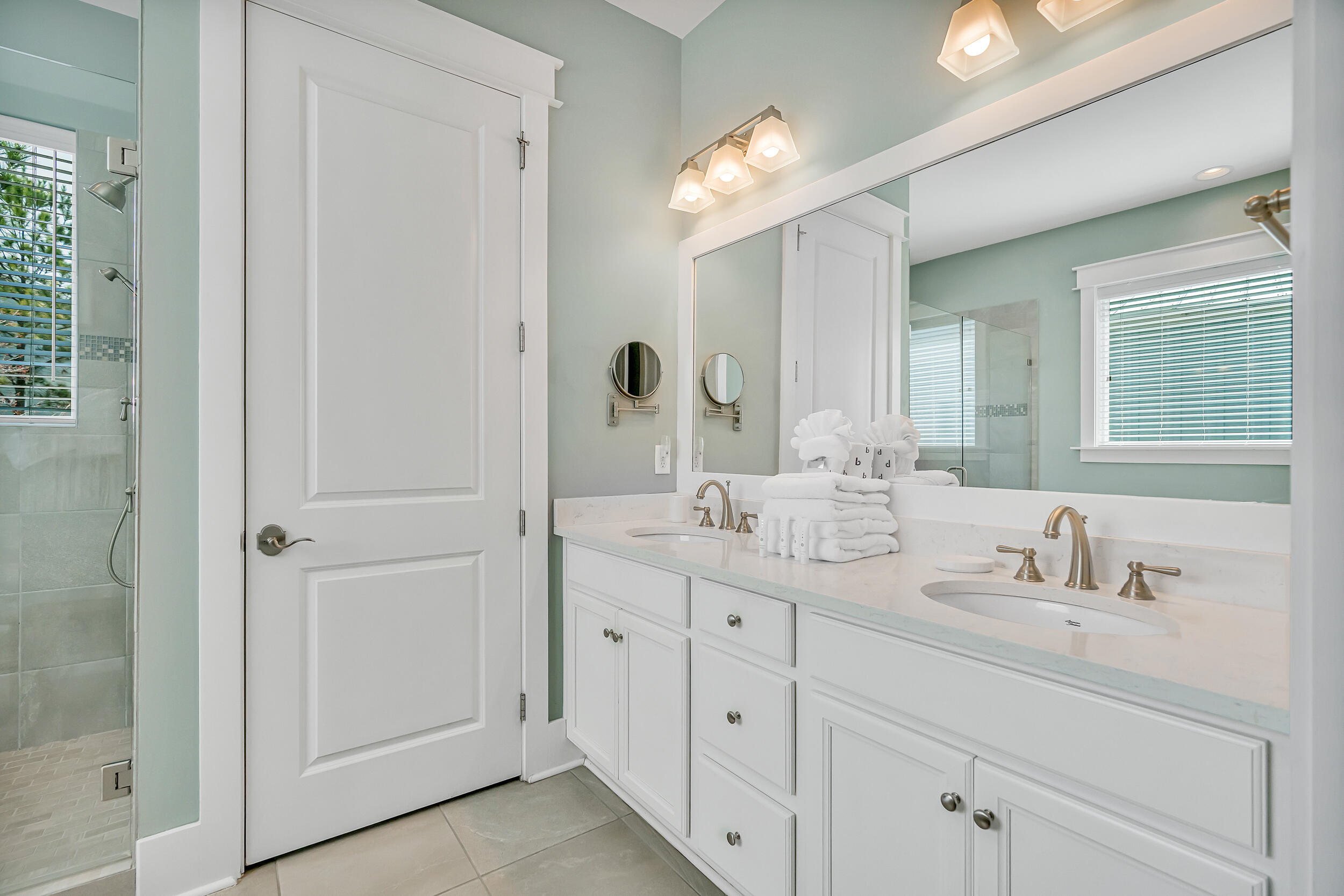 654 Flatwoods Forest Loop Santa Rosa Beach, FL 32459 - Photo 20 of 53 a bathroom with a double vanity sink and a mirror