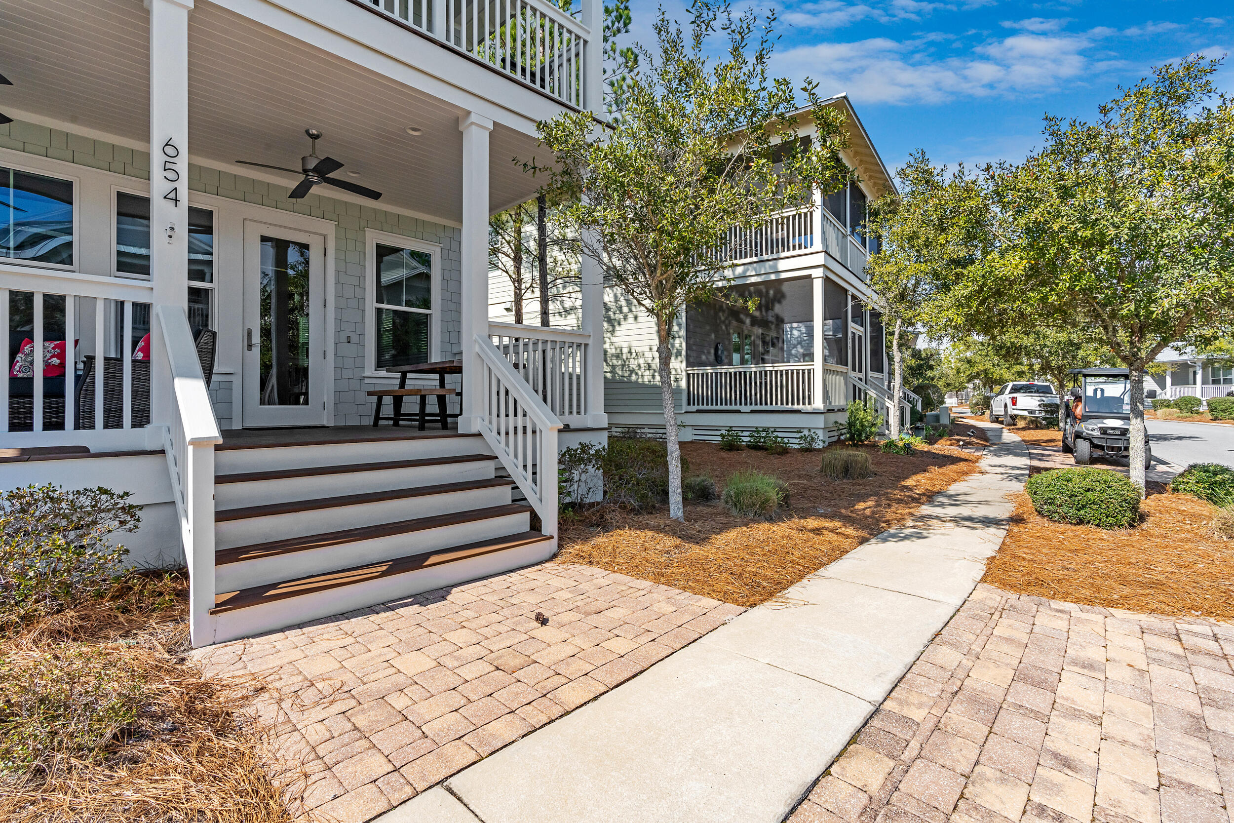 654 Flatwoods Forest Loop Santa Rosa Beach, FL 32459 - Photo 2 of 53 a view of a backyard with a patio
