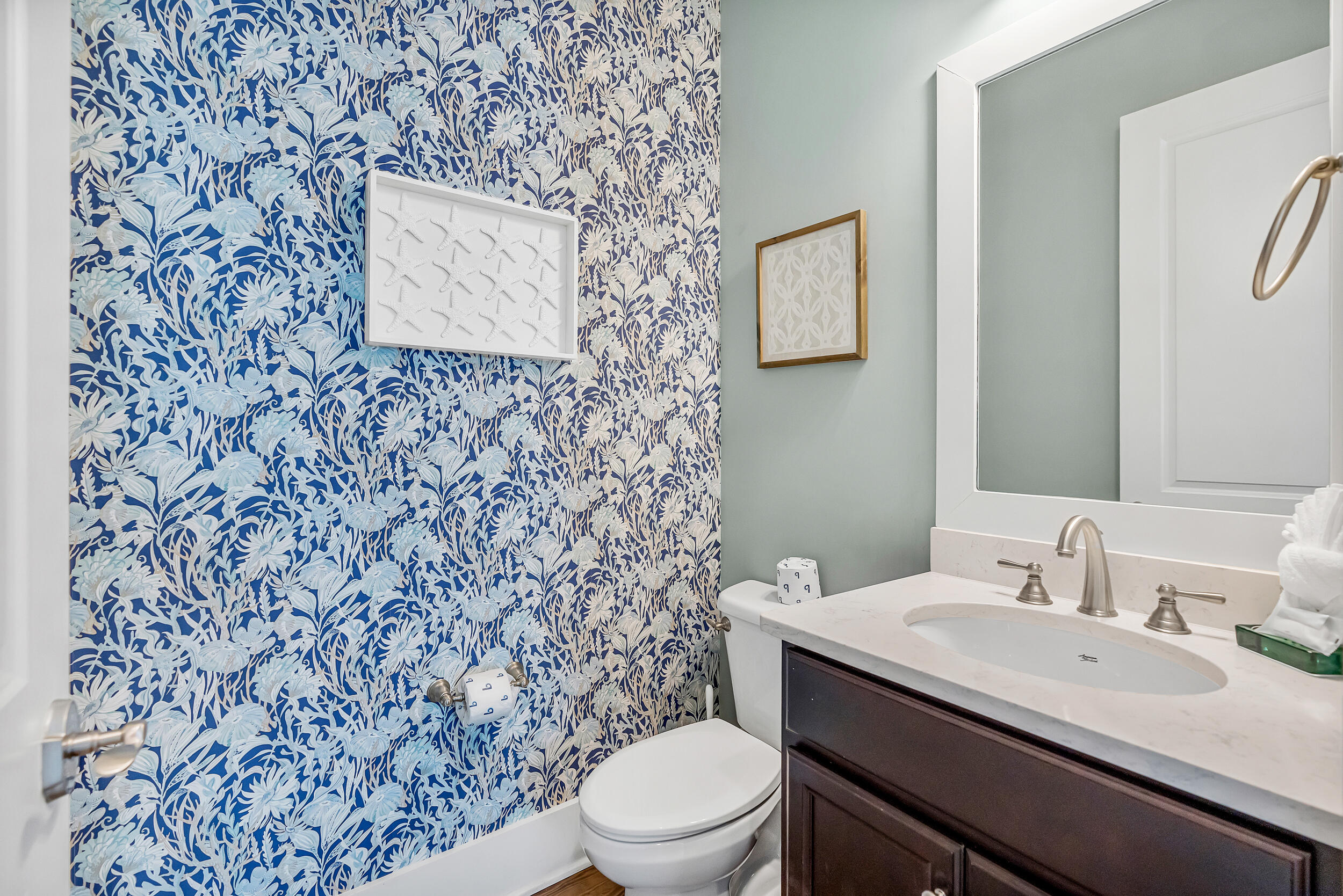 654 Flatwoods Forest Loop Santa Rosa Beach, FL 32459 - Photo 23 of 53 a bathroom with a granite countertop toilet sink and mirror