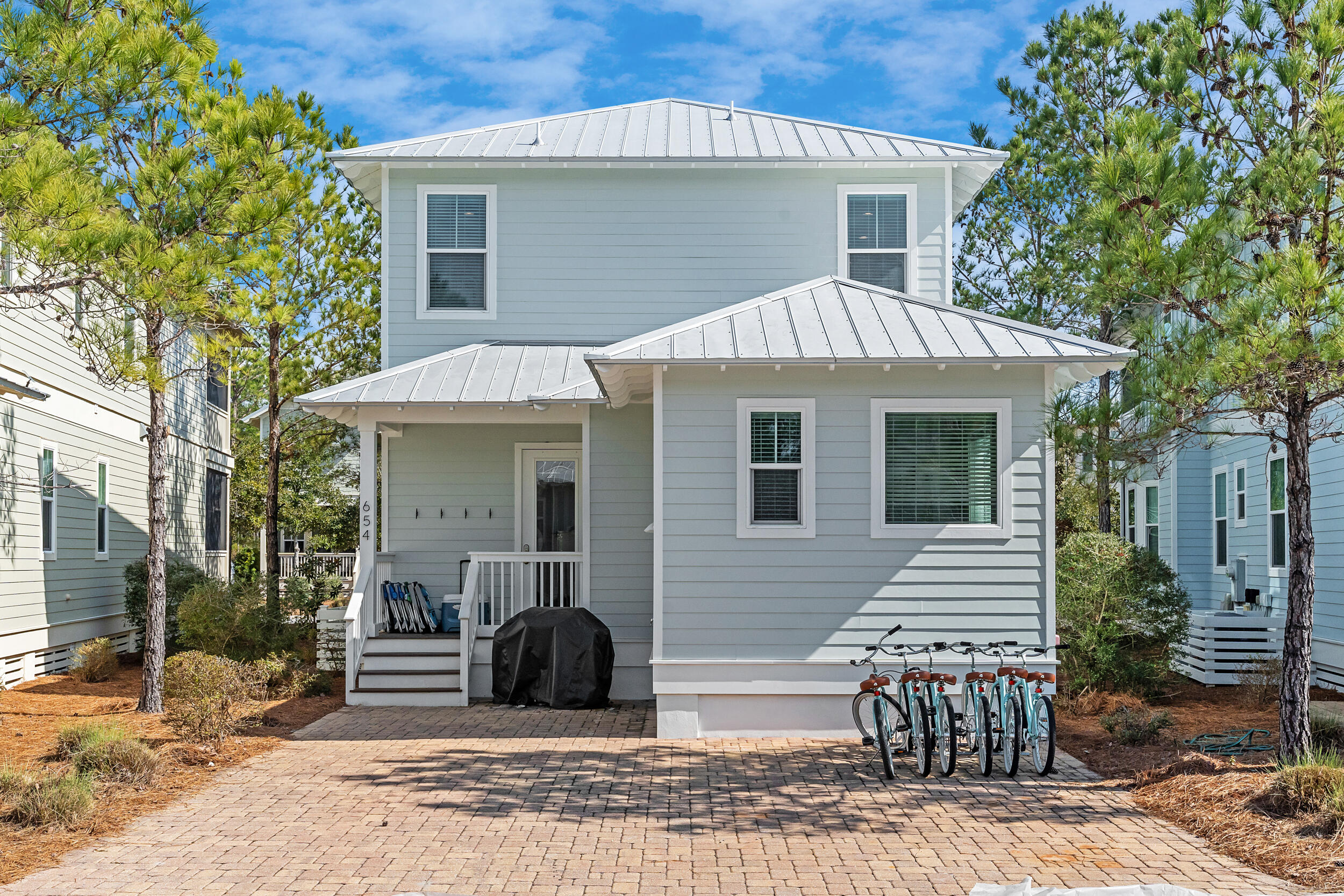 654 Flatwoods Forest Loop Santa Rosa Beach, FL 32459 - Photo 38 of 53 a view of a house with a patio