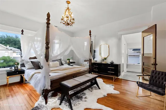 a bed room with a bed window and a table